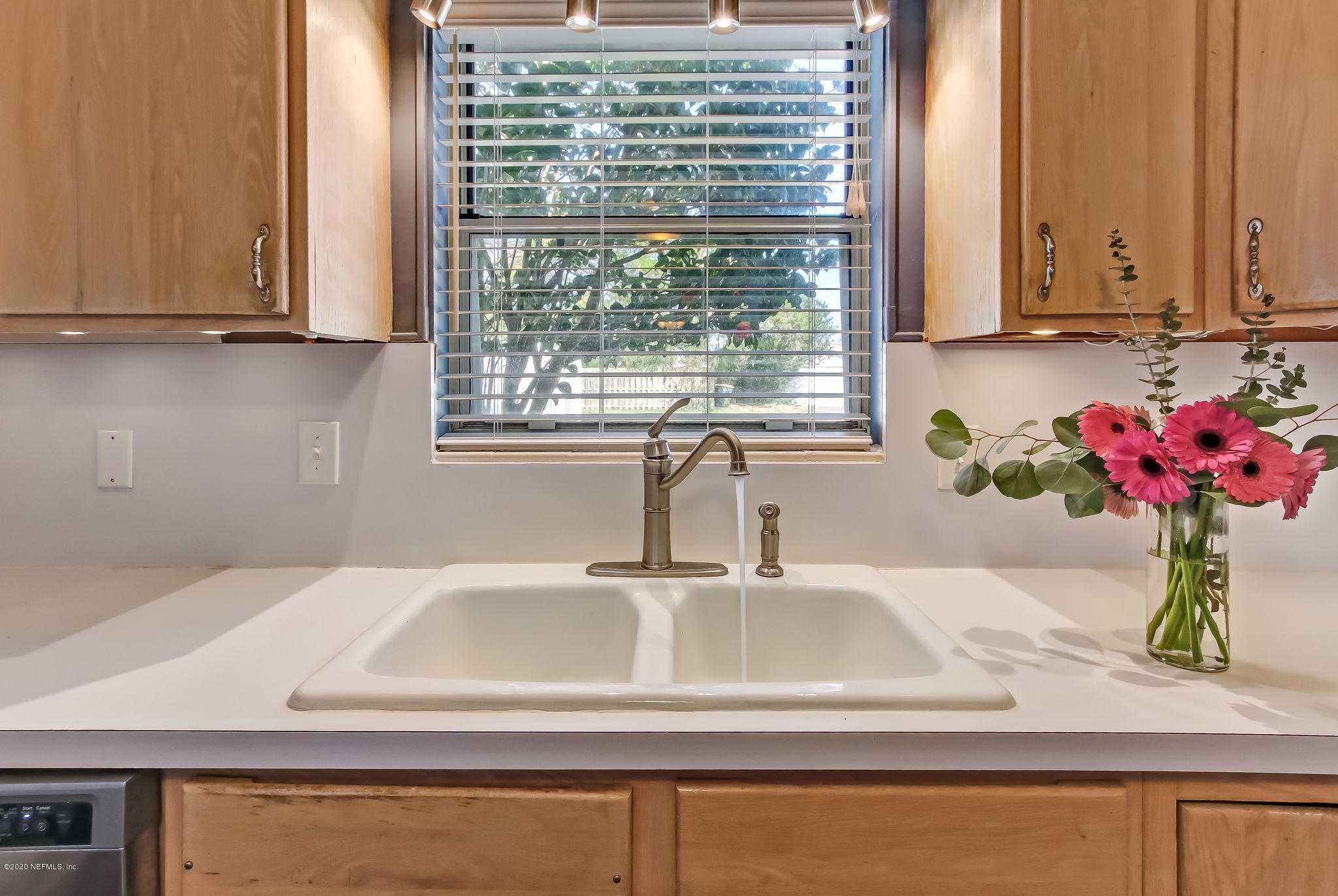 4006 Eunice Road Jacksonville, FL 32250 - Photo 19 of 30 a bathroom with a sink and a window
