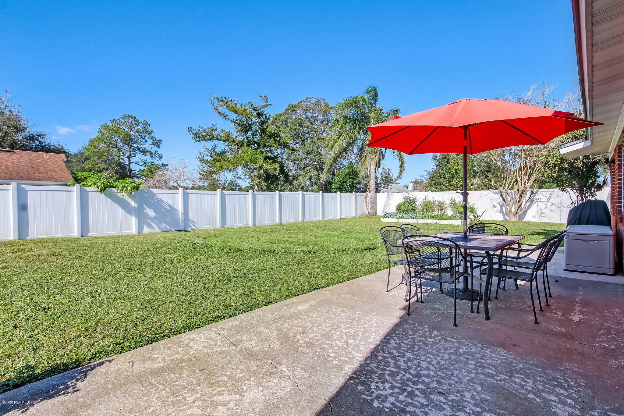 4006 Eunice Road Jacksonville, FL 32250 - Photo 27 of 30 a view of a house with backyard sitting area and backyard
