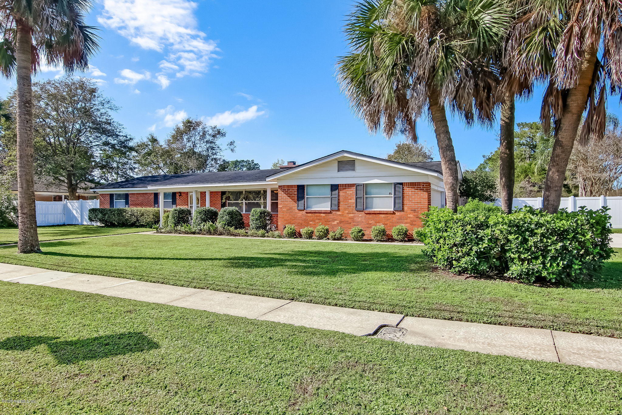 4006 Eunice Road Jacksonville, FL 32250 - Photo 3 of 30 a front view of a house with a garden