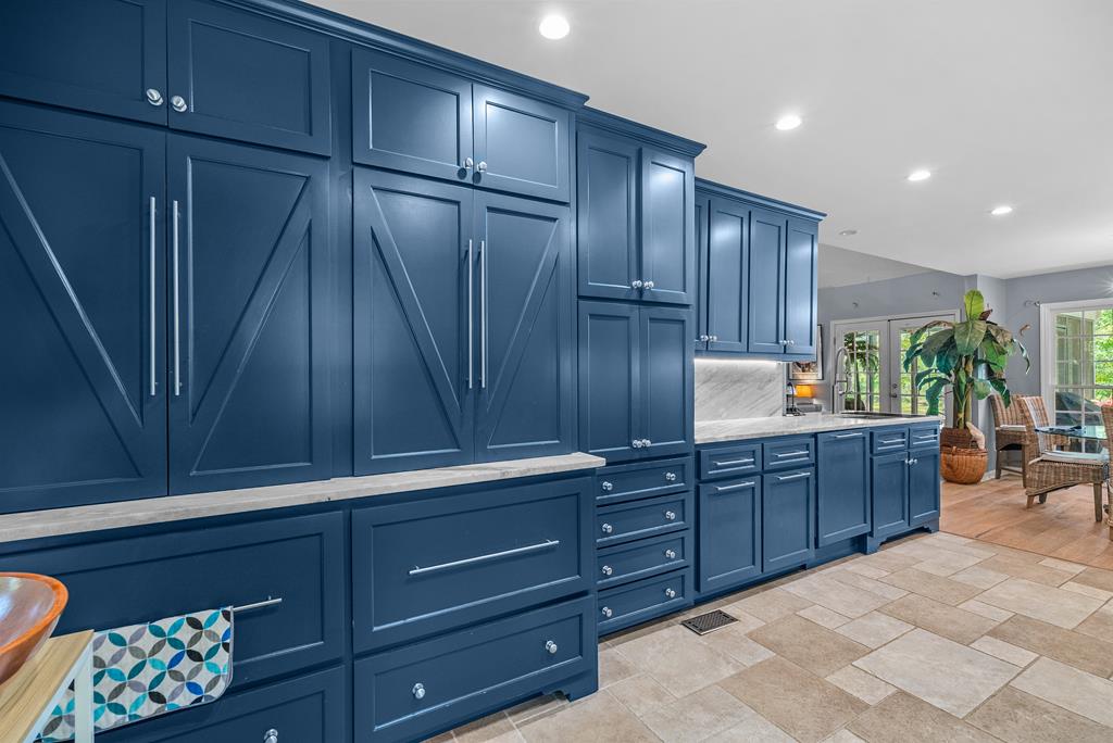 235 Epps Road Box Springs, GA 31801 - Photo 27 of 93 a kitchen with stainless steel appliances granite countertop wooden cabinets a refrigerator and a sink