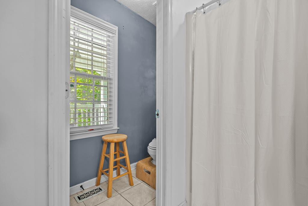 235 Epps Road Box Springs, GA 31801 - Photo 34 of 93 a view of a room that has a window and chair in it