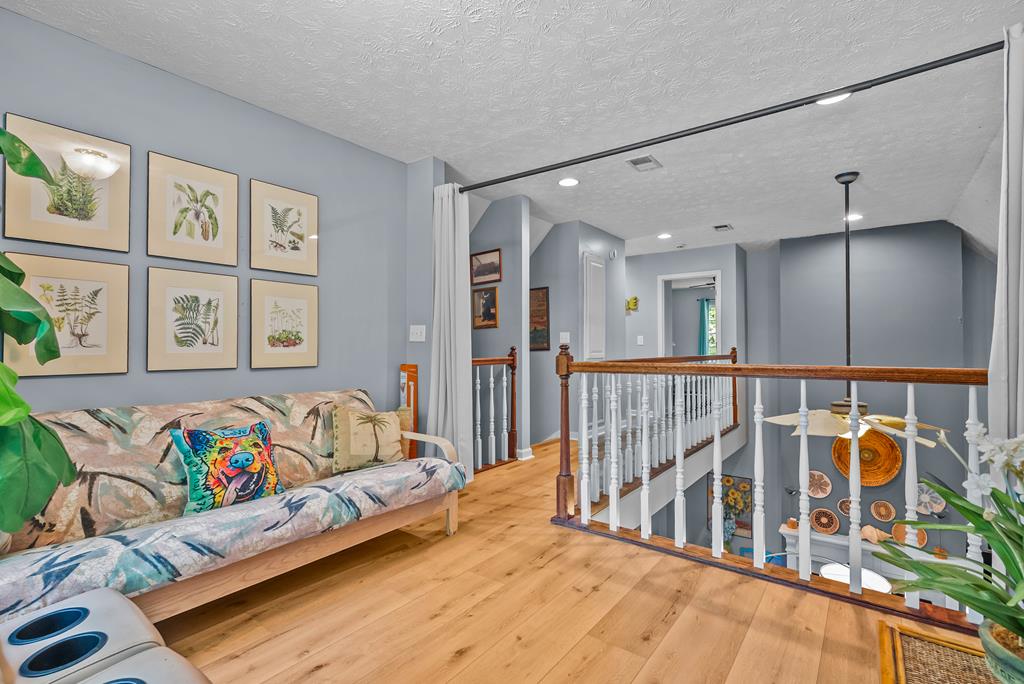 235 Epps Road Box Springs, GA 31801 - Photo 42 of 93 a bedroom with furniture and a wooden floor