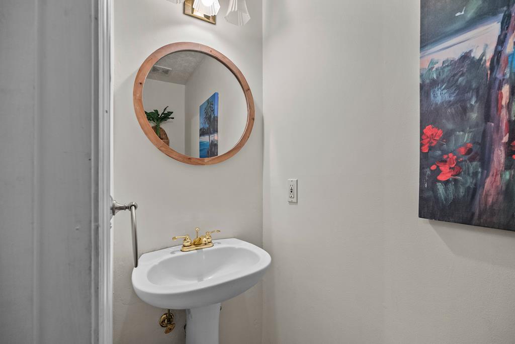 235 Epps Road Box Springs, GA 31801 - Photo 43 of 93 a bathroom with a sink and a mirror