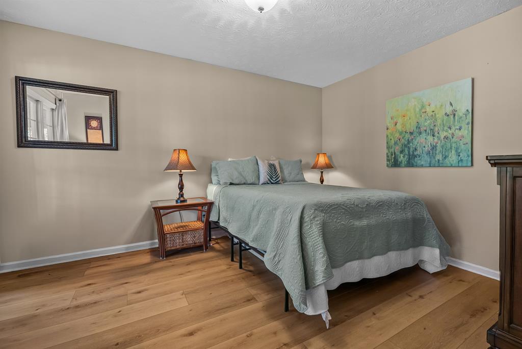 235 Epps Road Box Springs, GA 31801 - Photo 45 of 93 a bedroom with a bed and a painting on the wall