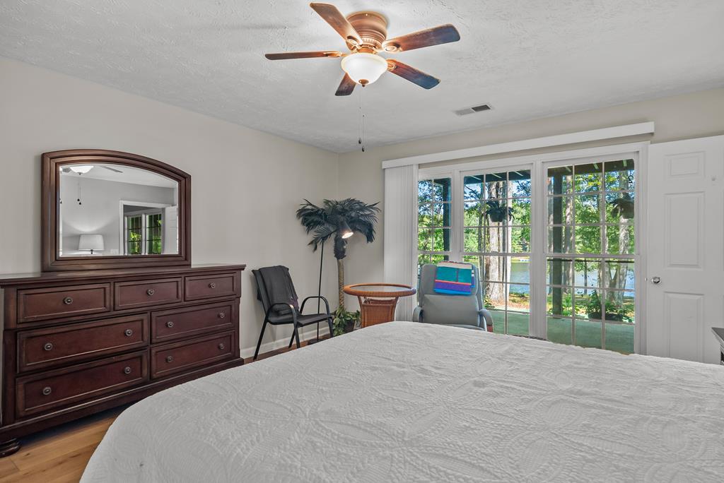 235 Epps Road Box Springs, GA 31801 - Photo 48 of 93 a bedroom with a bed and a large window