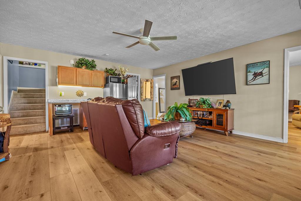 235 Epps Road Box Springs, GA 31801 - Photo 52 of 93 a living room with furniture and a flat screen tv