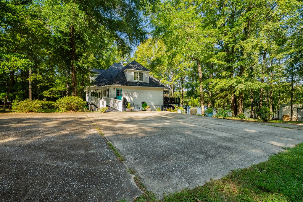 235 Epps Road Box Springs, GA 31801 - Photo 59 of 93 a front view of a house with a yard and garage