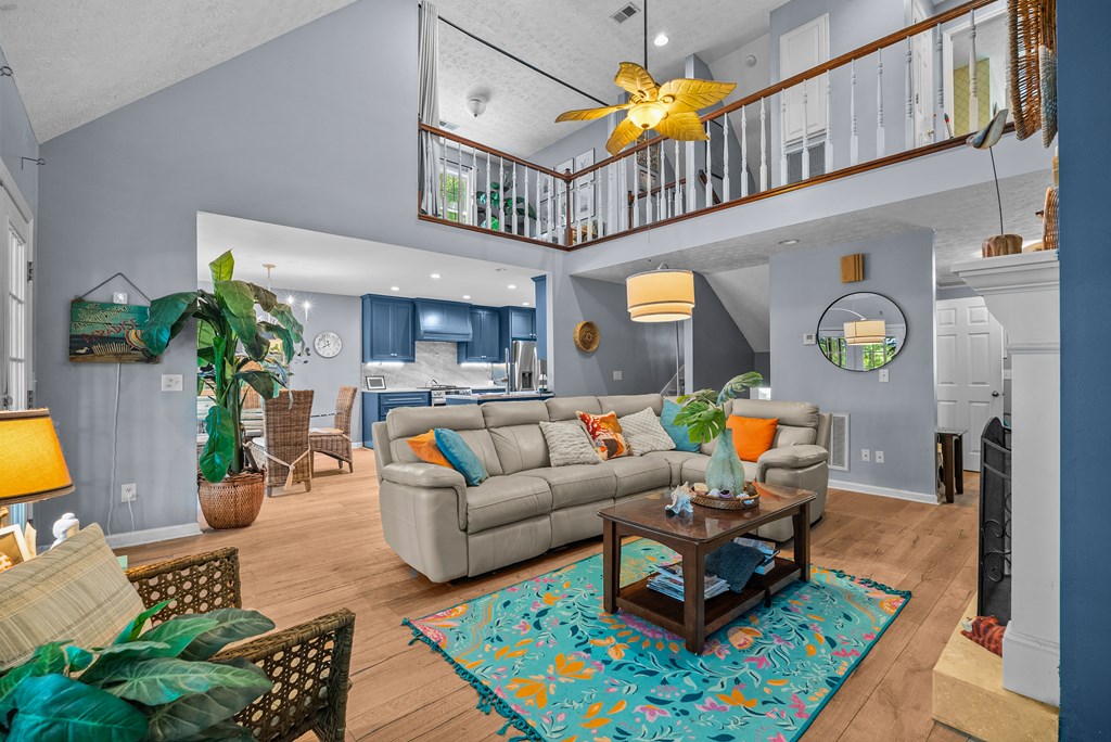 235 Epps Road Box Springs, GA 31801 - Photo 6 of 93 a living room with furniture a rug and a chandelier