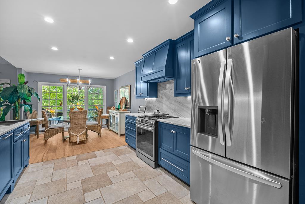 235 Epps Road Box Springs, GA 31801 - Photo 7 of 93 a kitchen with stainless steel appliances granite countertop a refrigerator a sink a stove and chairs
