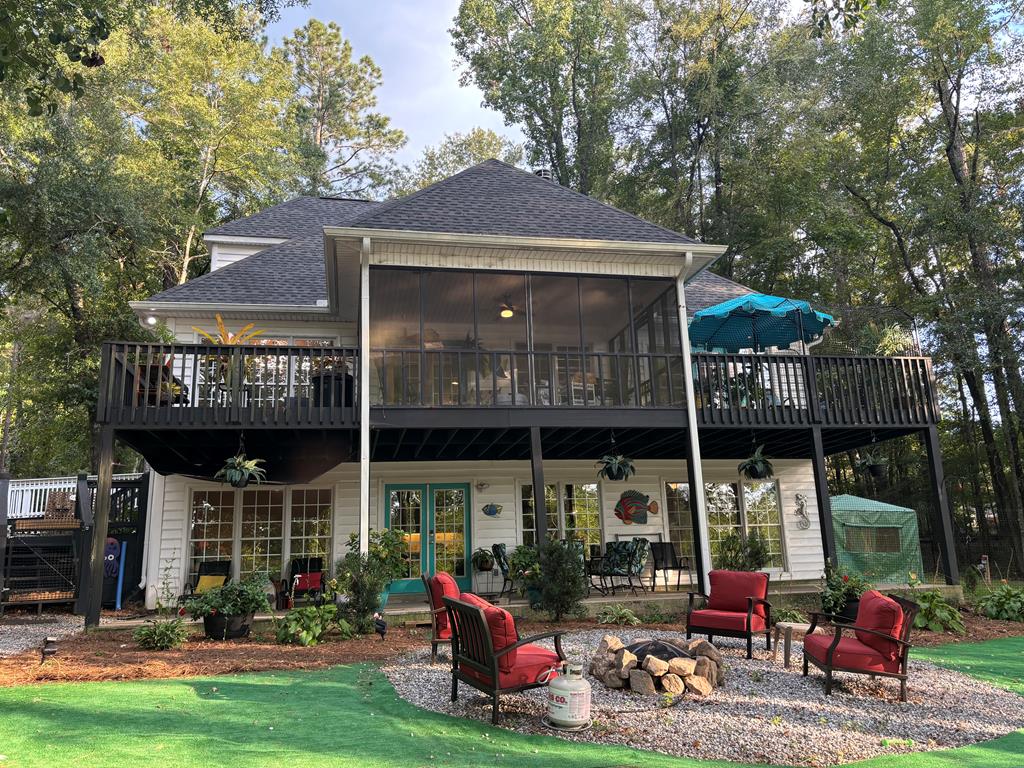235 Epps Road Box Springs, GA 31801 - Photo 90 of 93 a front view of a house with porch and outdoor seating