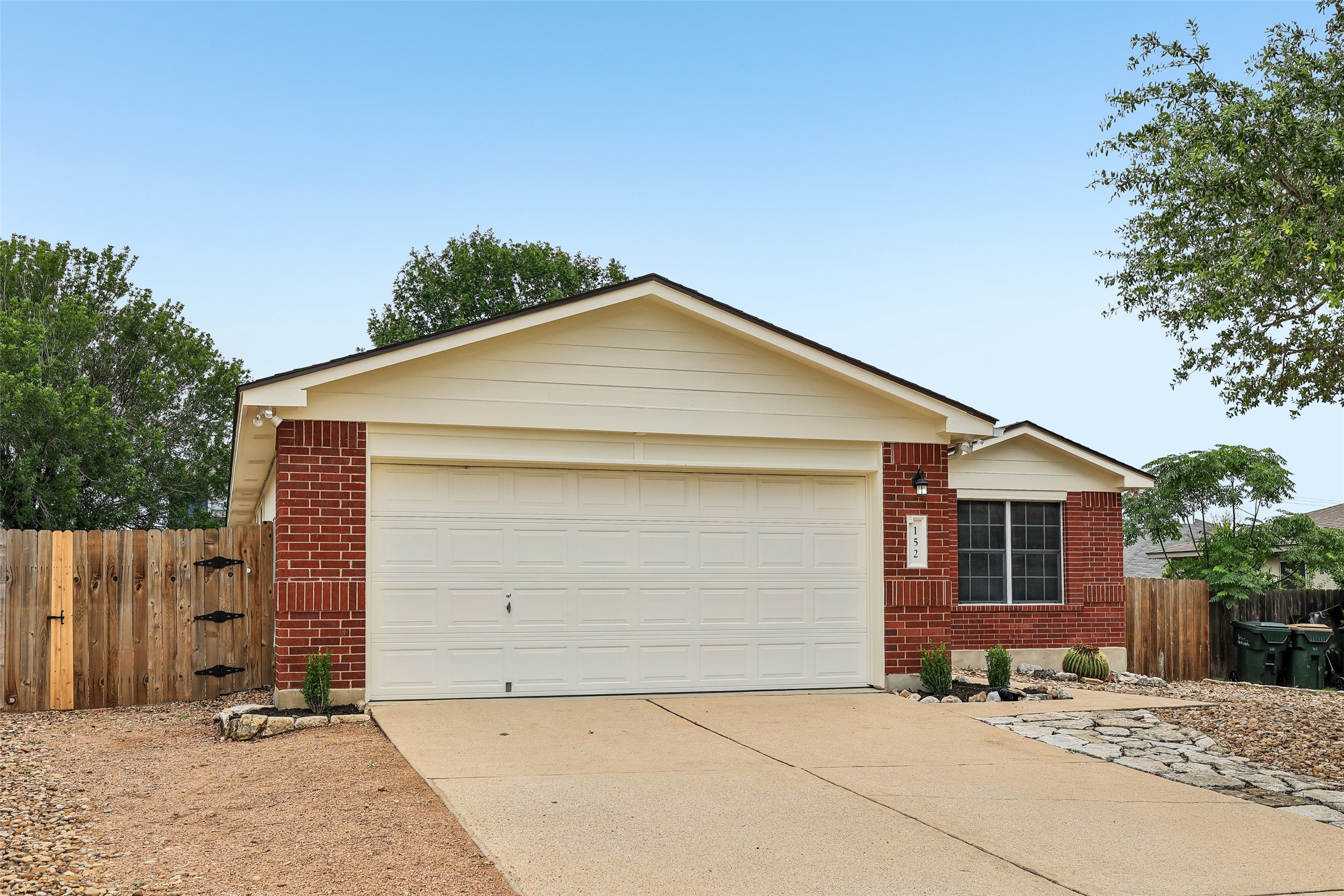 152 Grant Way Kyle, TX 78640 - Photo 6 of 39 a front view of a house with a yard