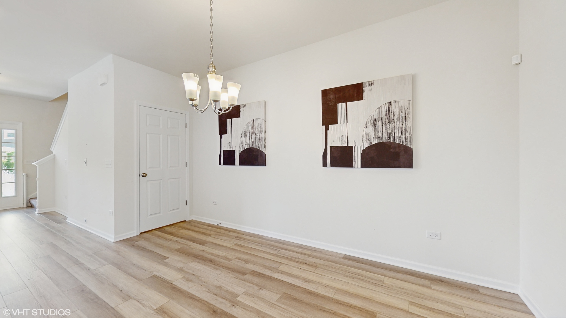 268 Hoffmann Drive, Unit 268 Buffalo Grove, IL 60089 - Photo 14 of 37 a view of a room with wooden floor and chandelier