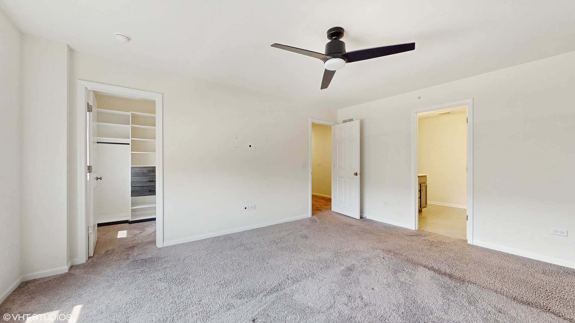 268 Hoffmann Drive, Unit 268 Buffalo Grove, IL 60089 - Photo 18 of 37 a view of a livingroom with a ceiling fan & entryway