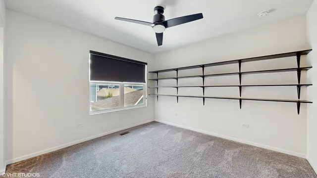 a bathroom with a toilet and a bath tub