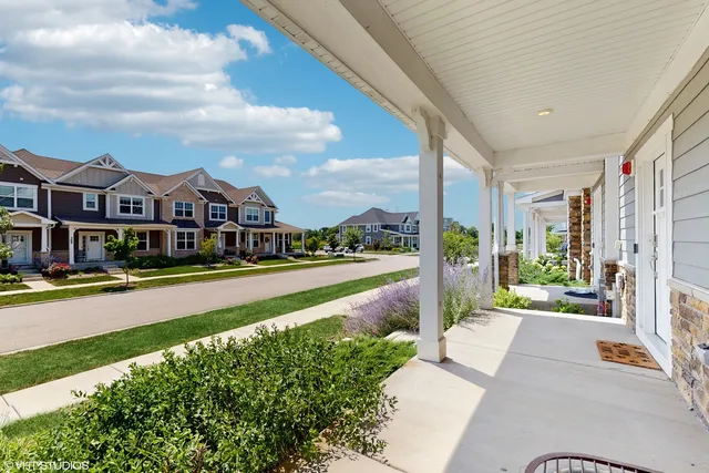a view of multiple houses with a yard