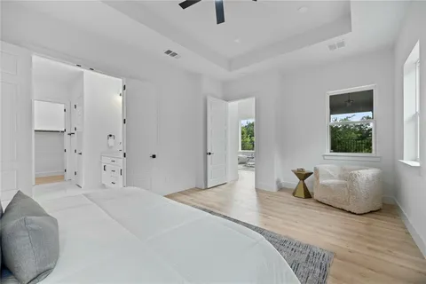 a bedroom with a bed and a couch