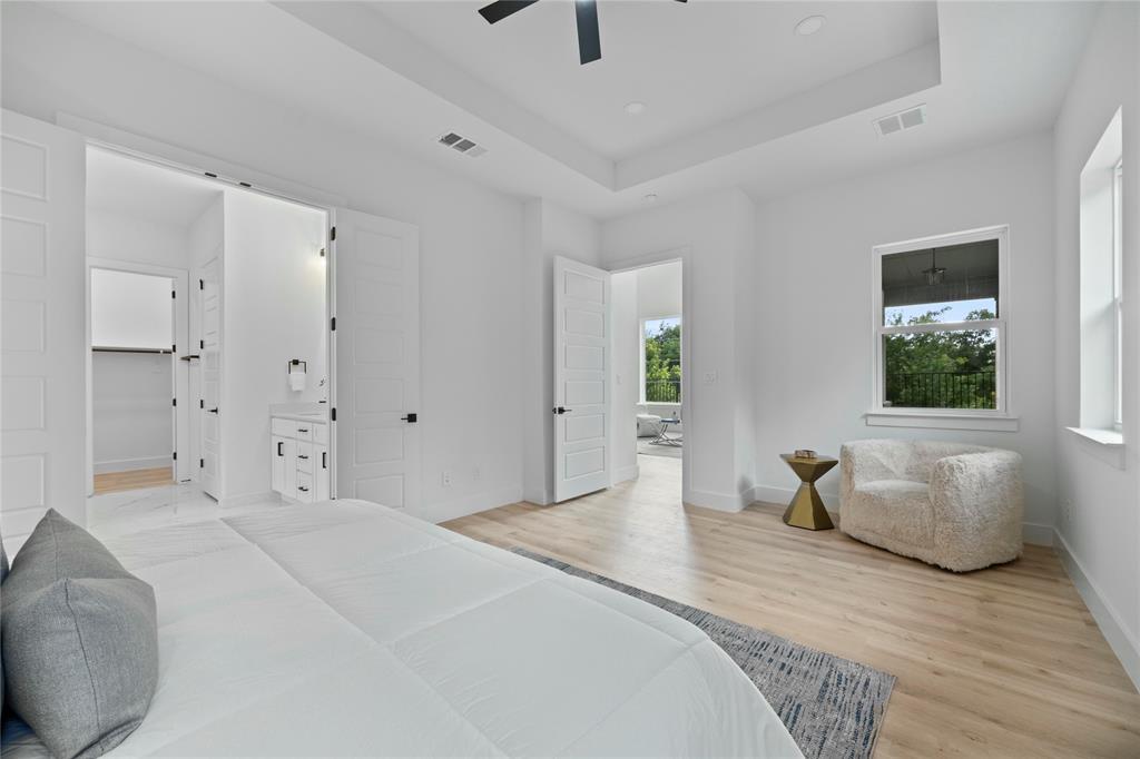 2121 Oak Haven Court Garland, TX 75044 - Photo 16 of 38 a bedroom with a bed and a couch