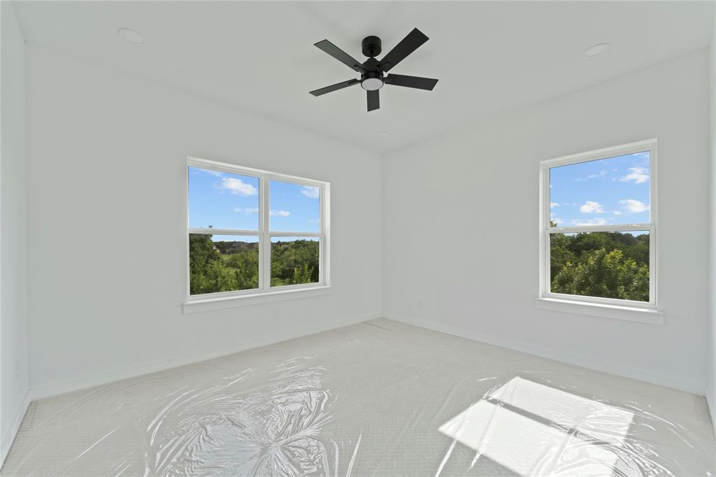 2121 Oak Haven Court Garland, TX 75044 - Photo 26 of 38 a view of a livingroom with a ceiling fan and window