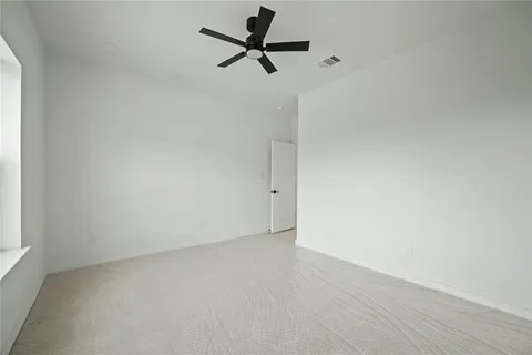 a view of an empty room with a fireplace