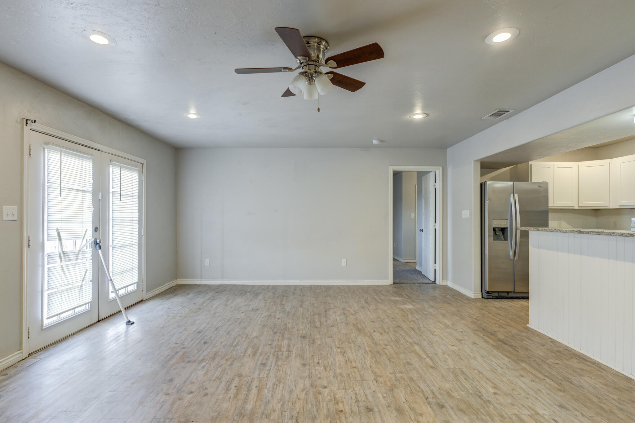 4320 52nd Street Lubbock, TX 79413 - Photo 11 of 59 a view of an empty room with a window