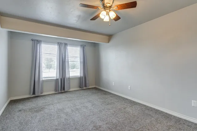 a view of a room that has a window in it