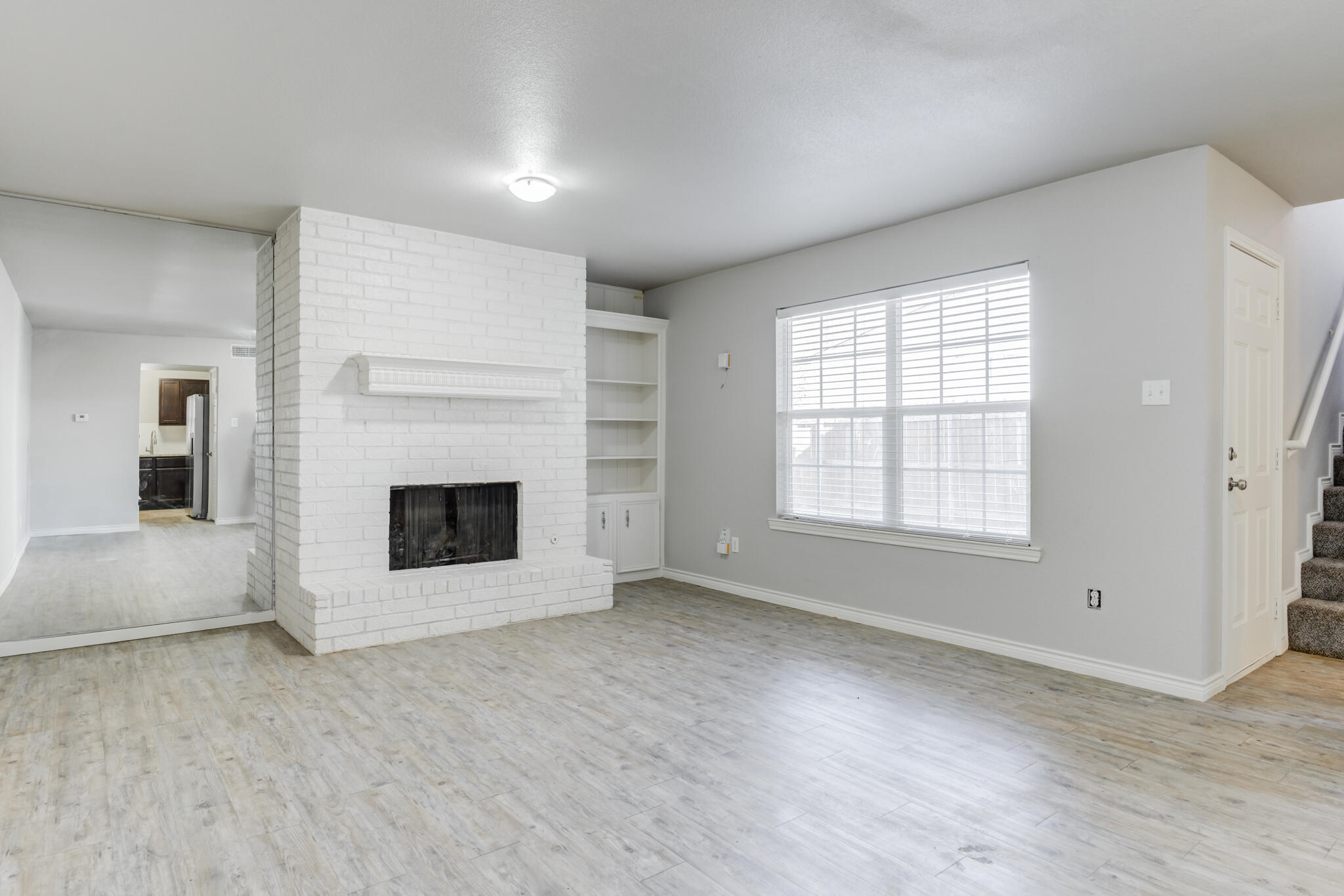 4320 52nd Street Lubbock, TX 79413 - Photo 37 of 59 an empty room with windows and fireplace