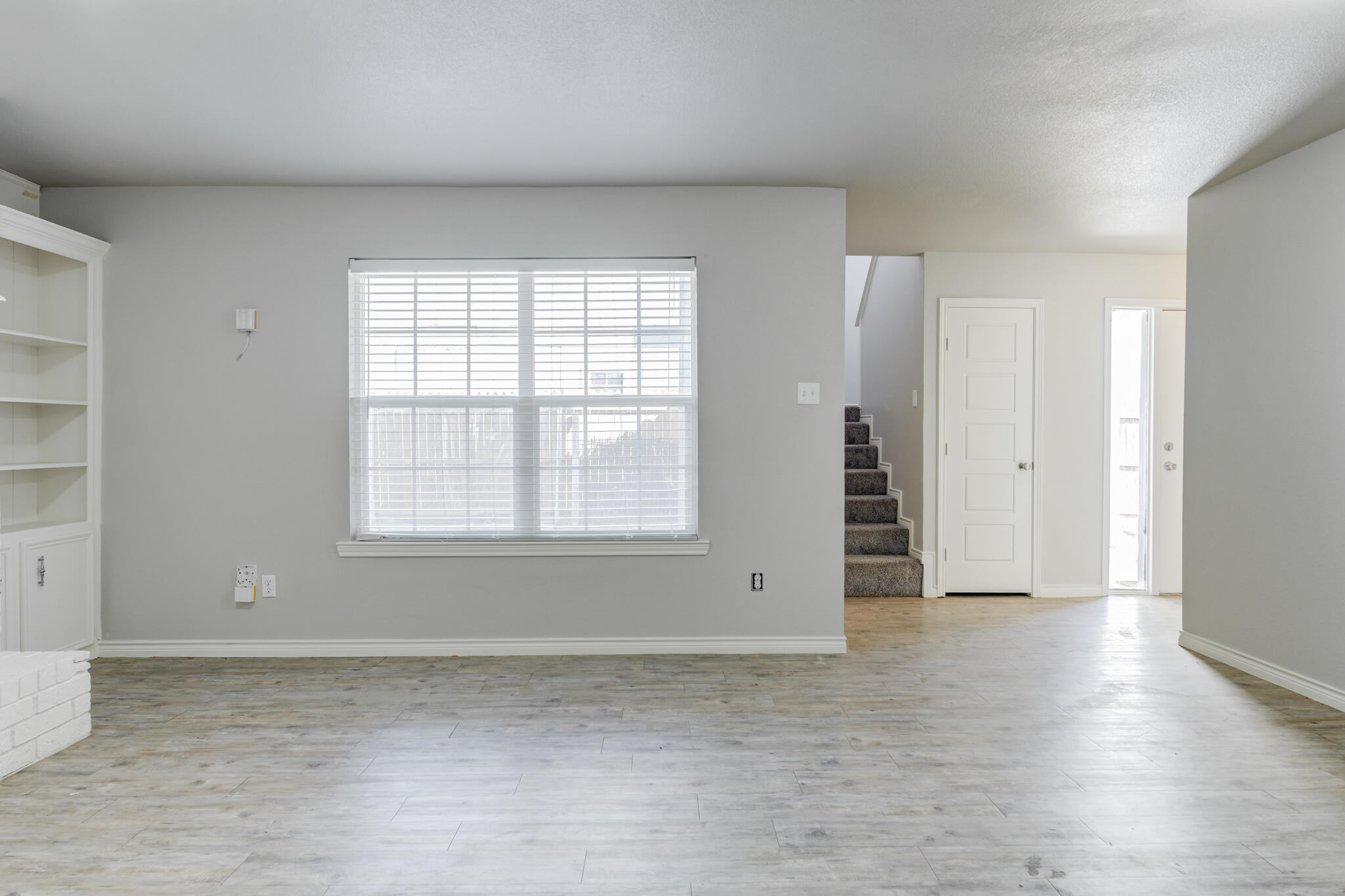 4320 52nd Street Lubbock, TX 79413 - Photo 38 of 59 an empty room with wooden floor and windows