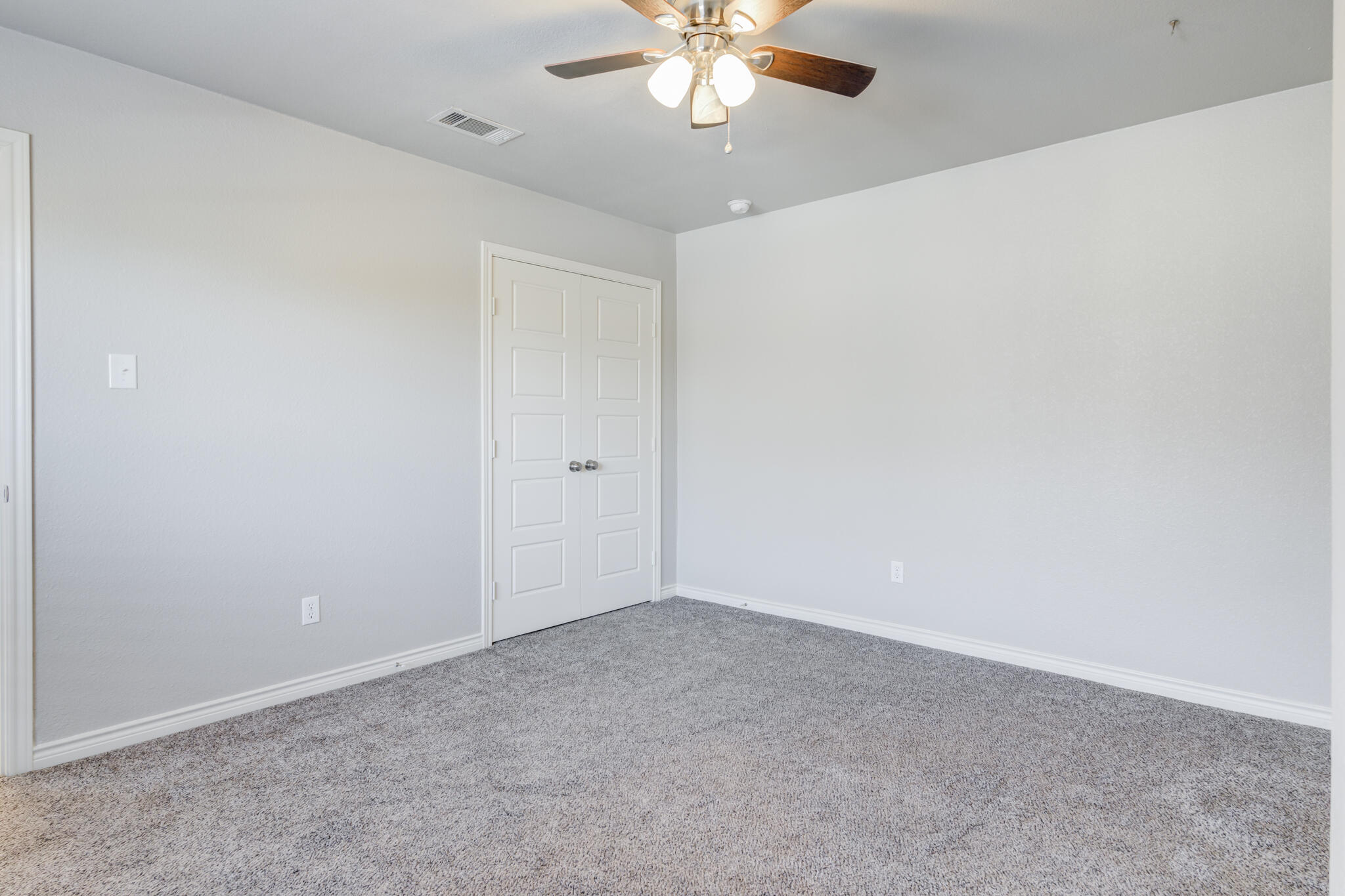 4320 52nd Street Lubbock, TX 79413 - Photo 51 of 59 a view of an empty room with a chandelier fan