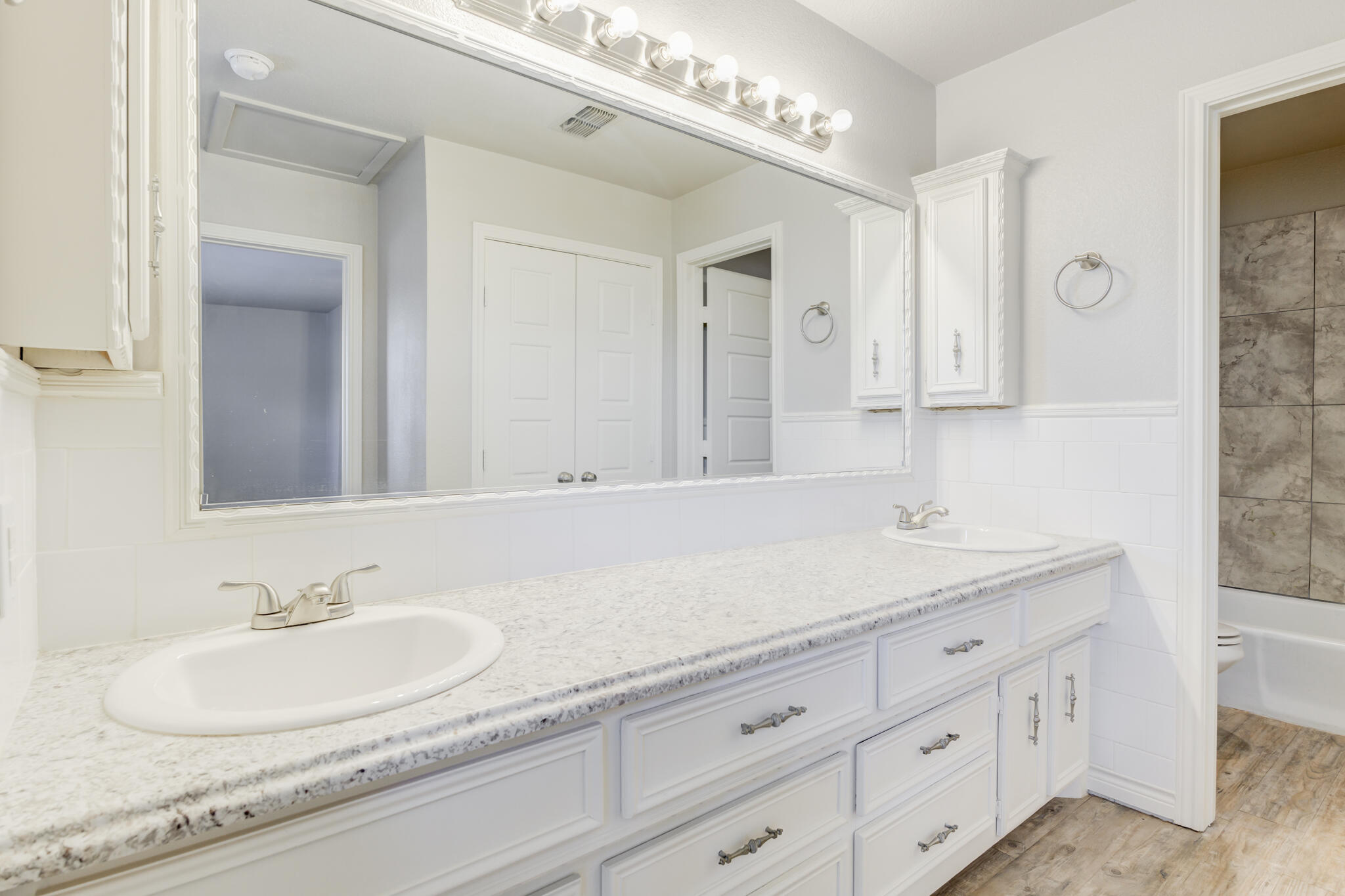 4320 52nd Street Lubbock, TX 79413 - Photo 53 of 59 a bathroom with a sink and a mirror
