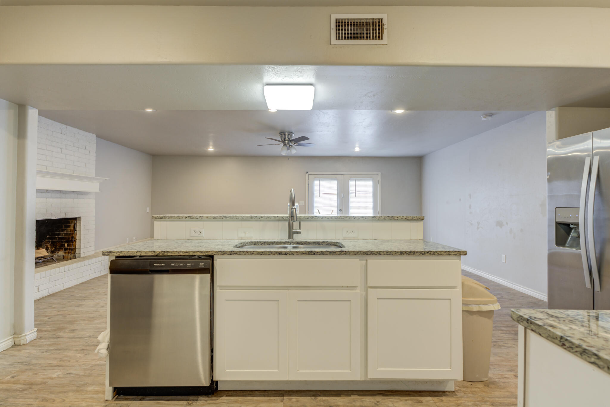 4320 52nd Street Lubbock, TX 79413 - Photo 6 of 59 a kitchen with granite countertop a sink and cabinets