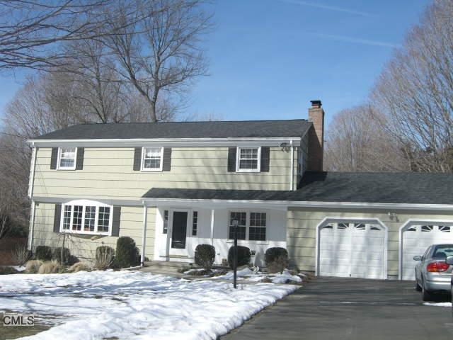 37 Autumn Ridge Road Trumbull, CT 06611 - Photo 1 of 1 a front view of a house with cars parked