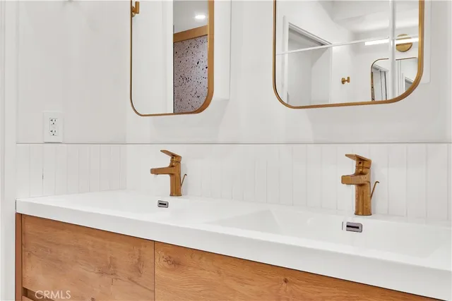 a bathroom with a bathtub and a sink