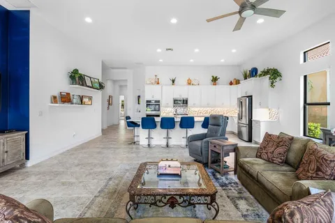a living room with furniture and a rug