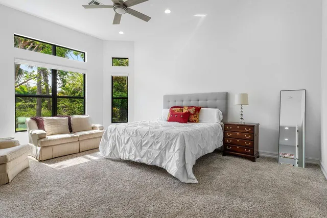 a bedroom with a bed and a couch