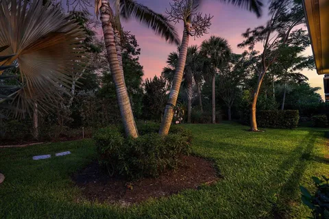 a backyard of a house with lots of green space