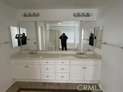 a bathroom with a bathtub and shower