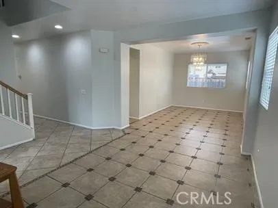 a view of an empty room and a window