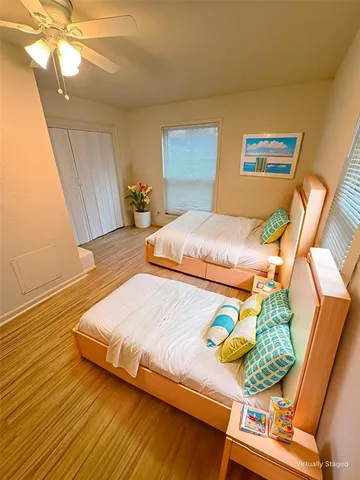 a bedroom with bed and a window