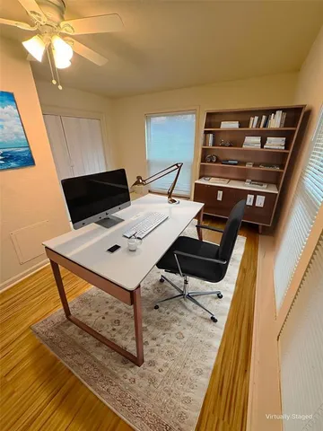a living room with chairs and a table
