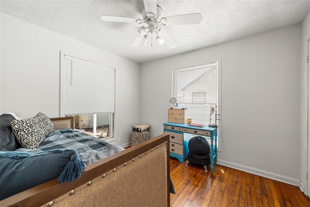 1205 Ashleman Street Bellmead, TX 76705 - Photo 21 of 33 a living room with furniture and a chandelier