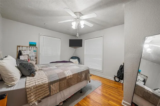 a bed room with a bed and a chandelier