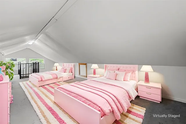 a bedroom with bed and a night stand