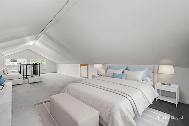 a large white bed in a white room