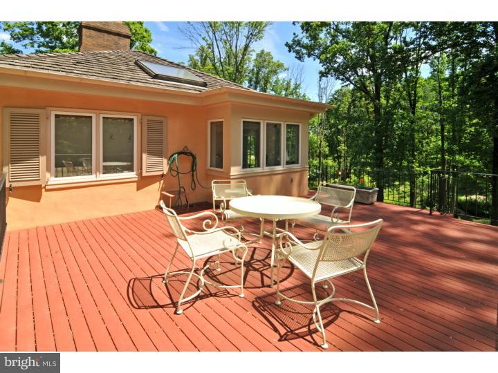 7 Andorra Hill Road Lafayette Hill, PA 19444 - Photo 19 of 23 a view of a patio with table and chairs with wooden floor and fence