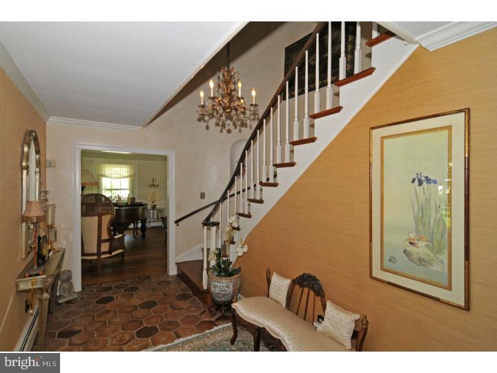 7 Andorra Hill Road Lafayette Hill, PA 19444 - Photo 5 of 23 a view of staircase with lots of frames and frames on wall