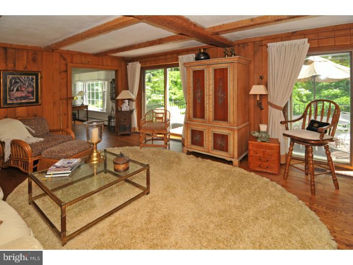 7 Andorra Hill Road Lafayette Hill, PA 19444 - Photo 10 of 23 a living room with furniture a window and a flat screen tv