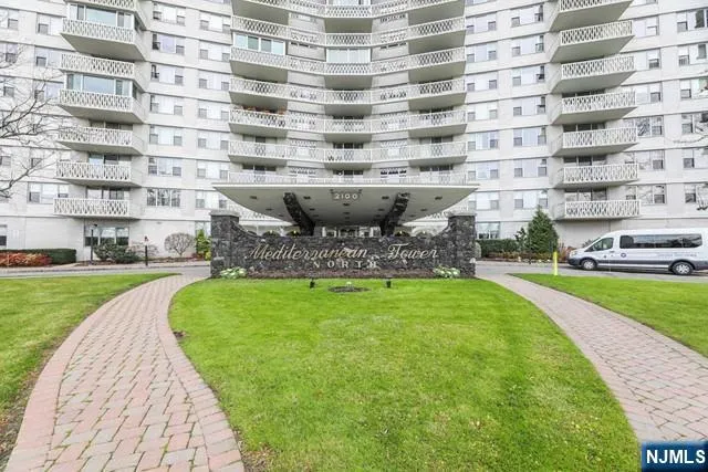 a view of a building with a yard