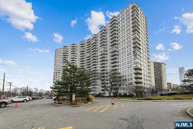 a view of a city street lined with tall buildings