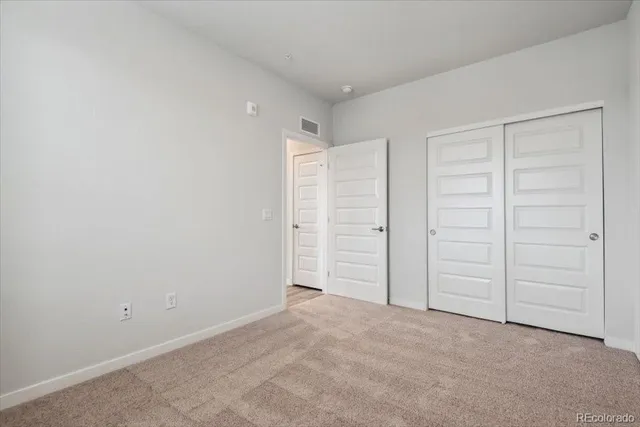 a view of a storage & utility room with a washer dryer