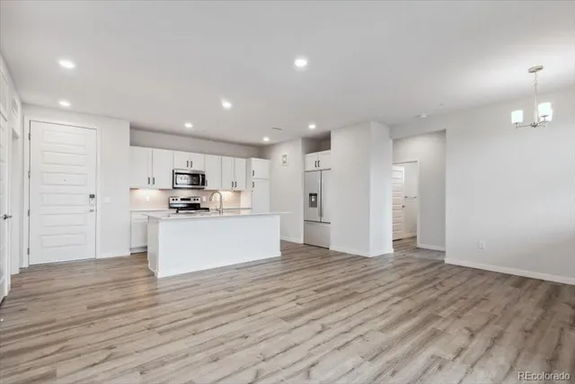 a view of kitchen with wooden floor